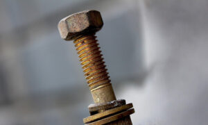Historic concrete anchor bolts showing early foundation fastening methods