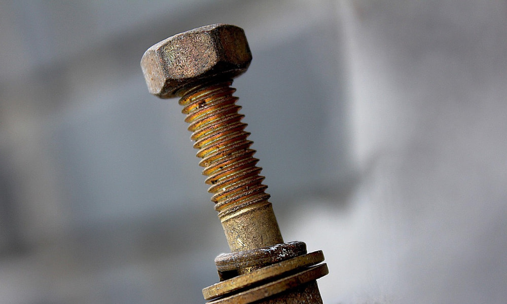 Historic concrete anchor bolts showing early foundation fastening methods