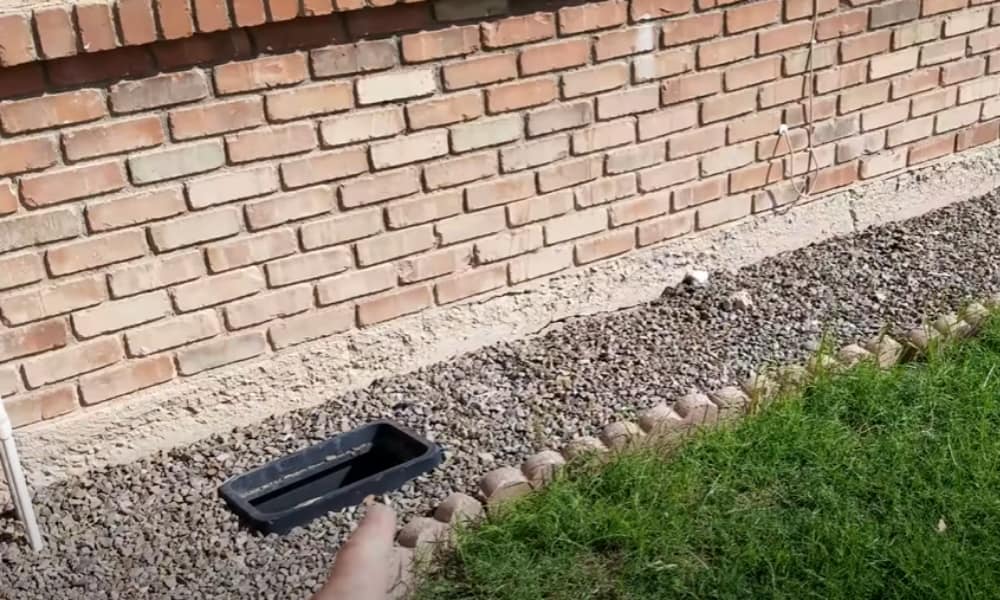 Retaining wall secured with center plate concrete bolts for added structural support